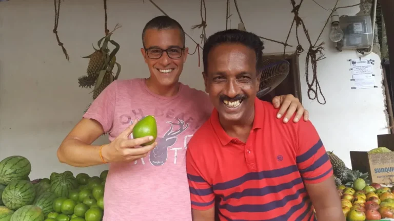 Susil sharing fresh fruit with a guest – Island Walkers